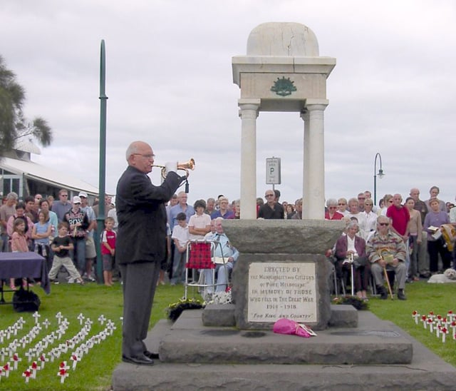 The Last Post is played at an Anzac Day ceremony in Port Melbourne, Victoria. Similar ceremonies are held in many suburbs and towns.