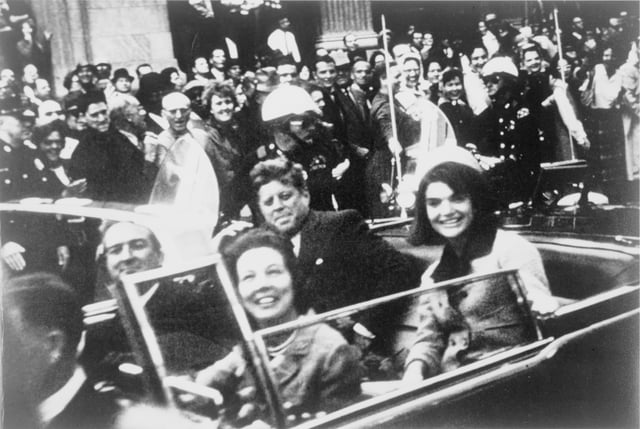 The President and First Lady  in the rear seat of the Presidential limousine minutes before the assassination