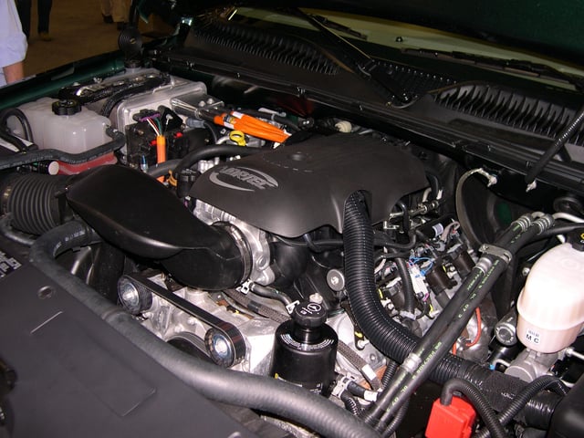 The engine compartment of a 2006 GMC Sierra Hybrid