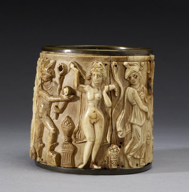 This circular Pyxis or box depicts two scenes. The one shown presents Hermes awarding the golden apple of the Hesperides to Aphrodite, whom Paris has selected as the most beautiful of the goddesses. The Walters Art Museum.