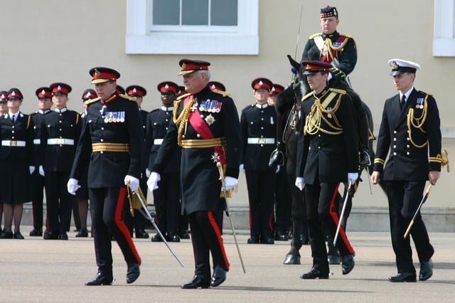 Officer Cadet Wales (standing to attention next to the horse) on parade at Sandhurst, 21 June 2005
