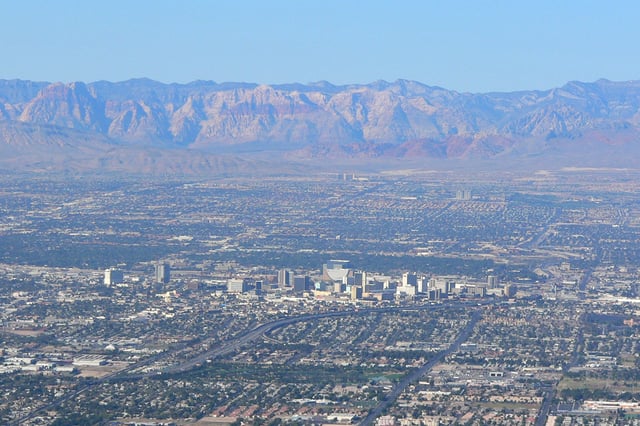 Downtown Las Vegas with Red Rock Canyon in the background.