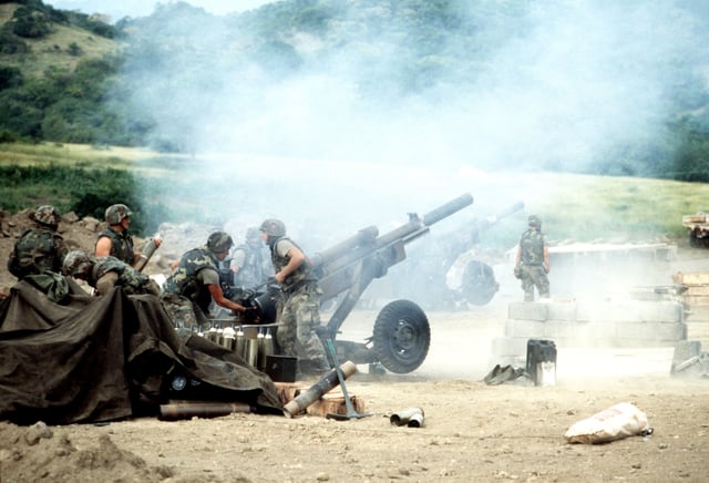 M102 howitzers of 1st Bn 320th FA, 82D Abn Div firing during battle
