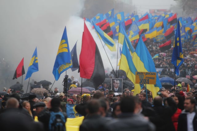 Ukrainian nationalists carry portraits of Stepan Bandera and flags of the Ukrainian Insurgent Army