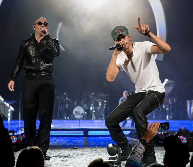 Pitbull performing with Enrique Iglesias at the Frank Erwin Center in Austin, Texas, 2015