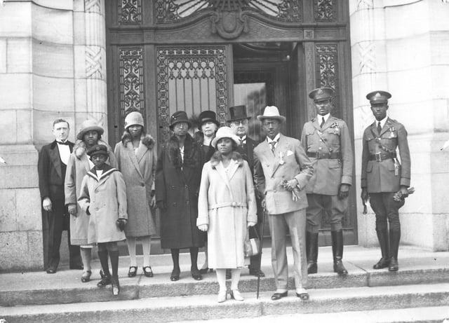 Charles D. B. King, 17th President of Liberia (1920–1930), with his entourage on the steps of the Peace Palace, The Hague (the Netherlands), 1927.