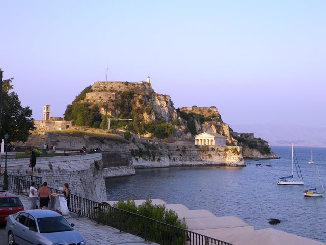 Palaio Frourio south elevation. The Venetian built moat is on the left and the Doric style St. George's Church built by the British can be seen in the background on the right.