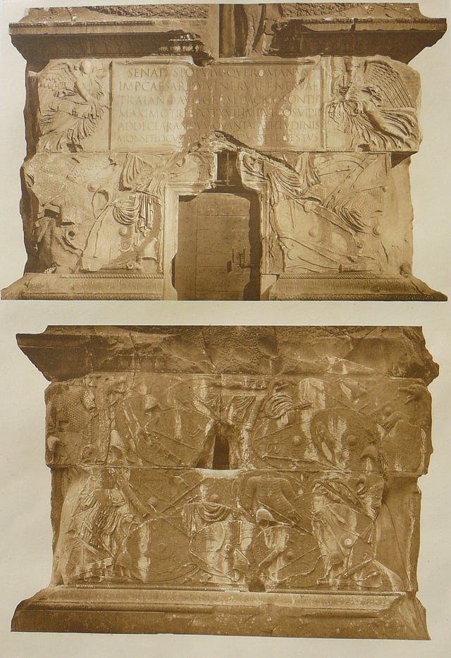 The inscription plate above the entrance to the interior (upper image)