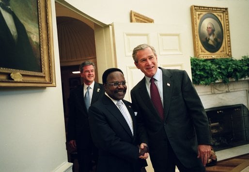 President George W. Bush welcomes President Omar Bongo to the Oval Office, May 2004