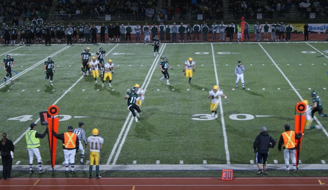 The Golden Bears football team playing football against the University of Saskatchewan Huskies. Football is one of 13 varsity programs offered by the University's athletics program.