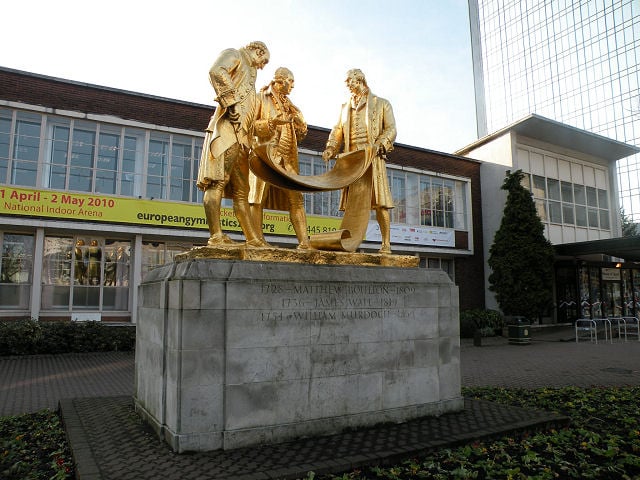 Boulton, Watt and Murdoch, a 1956 statue on Broad Street in Birmingham; the SI unit of power is the watt, most commonly found as the kW, a replacement for the imperial measurement of horsepower