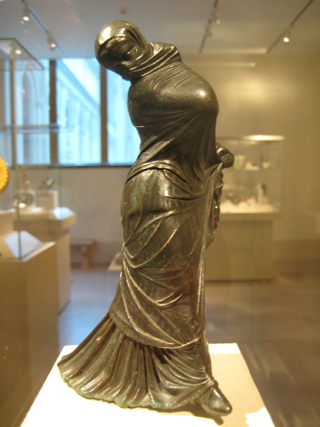 Greek bronze statuette of a veiled and masked dancer, 3rd–2nd century BC, Alexandria, Egypt.