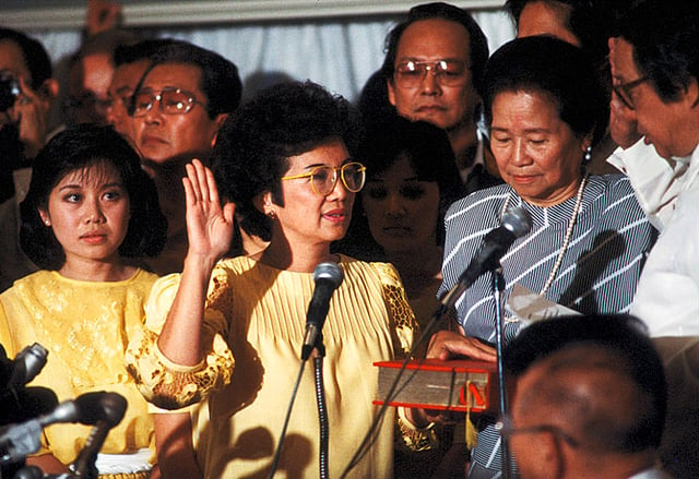 Corazon Aquino taking the Oath of Office, becoming the first female president in Asia