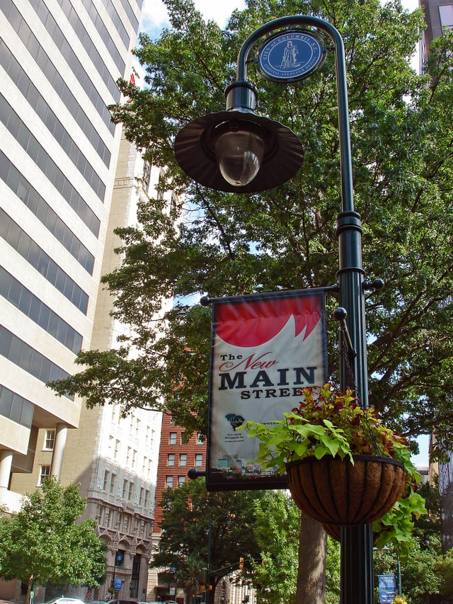 A downtown lightpost banner heralds Columbia's "New Main Street" as part of an effort to reinfuse life and vitality into Main Street.