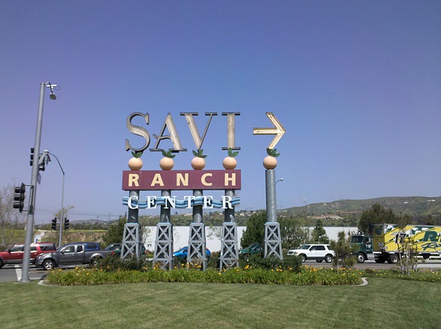 The original sign, since replaced with one in a Spanish style