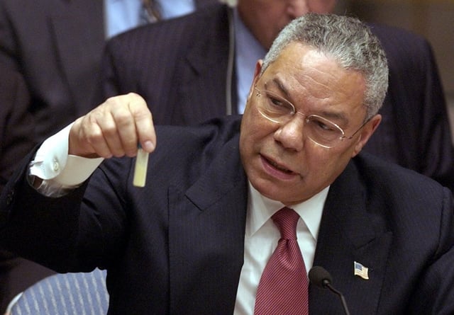 Colin Powell, the US Secretary of State, demonstrates a vial with alleged Iraqi chemical weapon probes to the UN Security Council on Iraq war hearings, 5 February 2003.