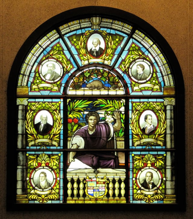 Dickens portrait (top left), in between Shakespeare and Tennyson, on a stained glass window at the Ottawa Public Library, Ottawa, Canada
