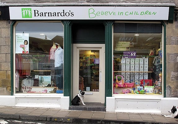 A Barnardo's charity shop in Jedburgh, Scotland. Barnardo's current tagline is "Believe in children".