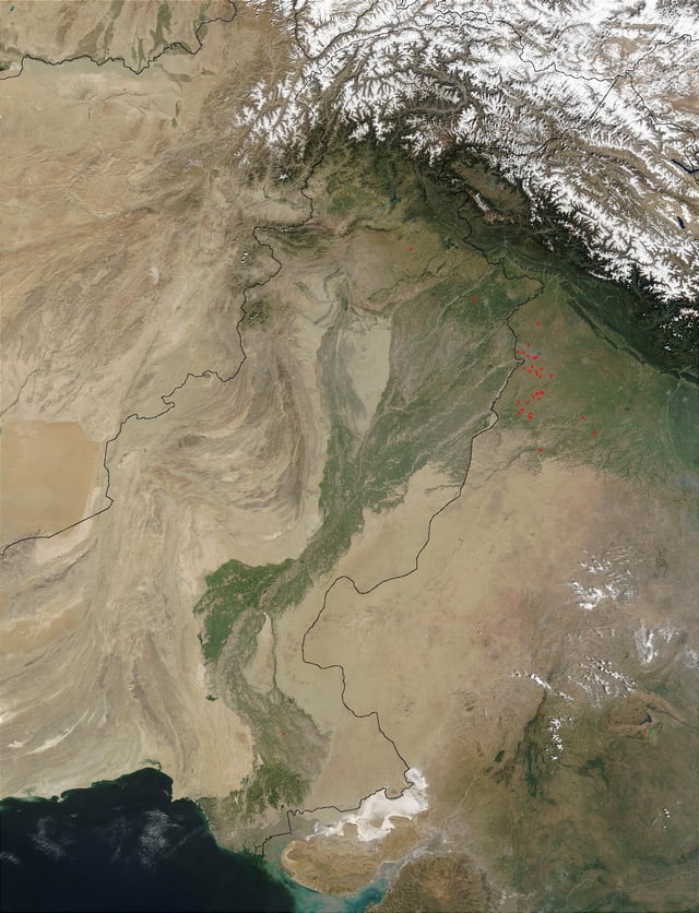 Satellite view of the Indus River, showing snow in the Himalayas, which feeds it, and green areas that draw on it for irrigation
