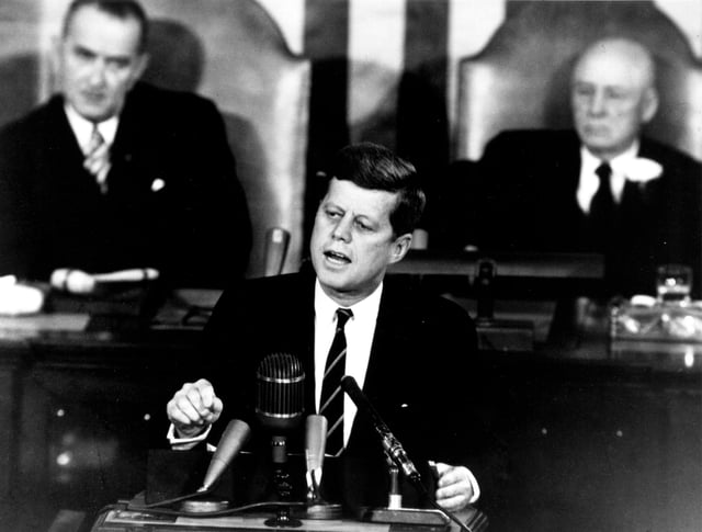 Kennedy proposing a program to Congress that will land men on the Moon, May 1961. Johnson and Sam Rayburn are seated behind him.