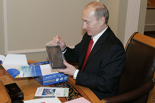 President Vladimir Putin with a GLONASS car navigation device. As President, Putin paid special attention to the development of GLONASS.