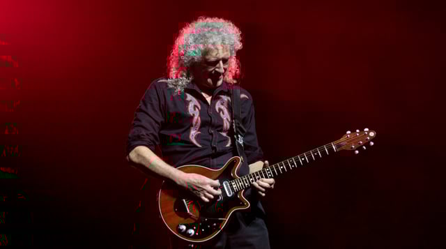 Brian May playing his custom-made Red Special at the O2 Arena in London in 2017. He has used this guitar almost exclusively since the band's advent in the early 1970s.