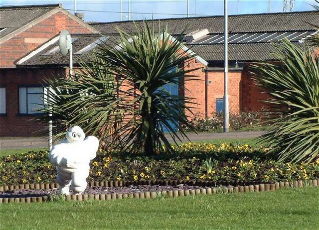 The Michelin Man (Bibendum) at Sideway in Stoke, with his name originating from the Latin phrase Nunc est bibendum
