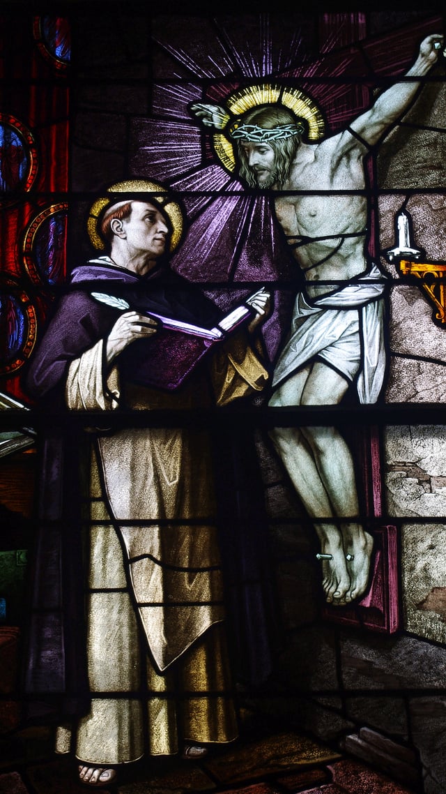 Icon of the crucifixion speaking to Thomas Aquinas is depicted on this stained glass window in Saint Patrick Church (Columbus, Ohio)