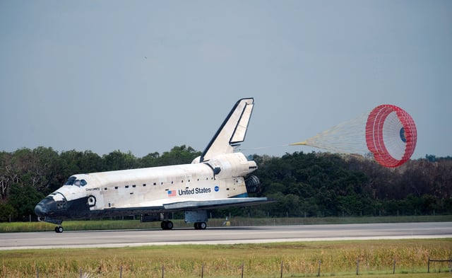 Discovery deploying its brake parachute after landing on STS-124.