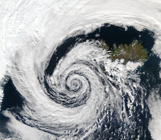 This low-pressure system over Iceland spins counterclockwise due to balance between the Coriolis force and the pressure gradient force.