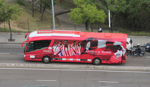 Atlético de Madrid's bus, decorated with red and white colours