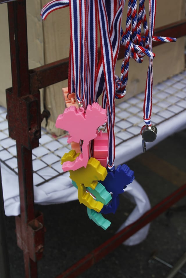Plastic whistles in the shape of Thailand on sale by anti-government protest groups.