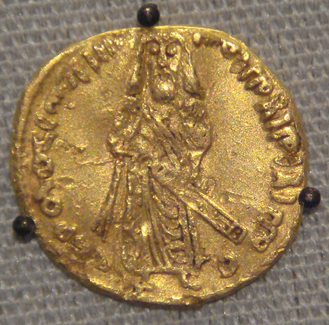 Coin of the Umayyad Caliphate, based on a Byzantine prototype, 695