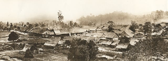 Part of a panoramic view of Kuala Lumpur c. 1884. To the left is the Padang. The buildings were constructed of wood and atap before regulations were enacted by Swettenham in 1884 requiring buildings to use bricks and tiles. The appearance of Kuala Lumpur transformed rapidly and greatly in the following years.