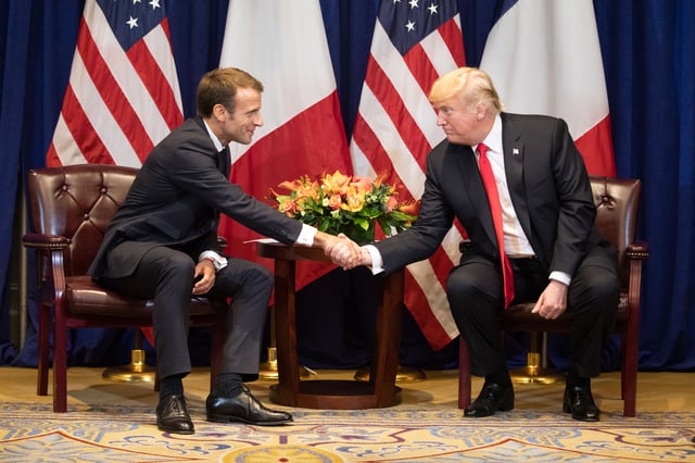 Macron shakes hands with US President Donald Trump in September 2018