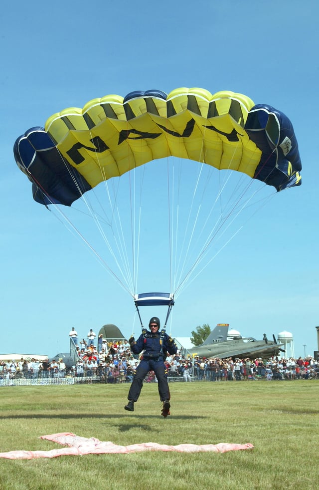 A member of the U.S. Navy Parachute Demonstration Team, the "Leap Frogs", returns to earth after a successful jump.