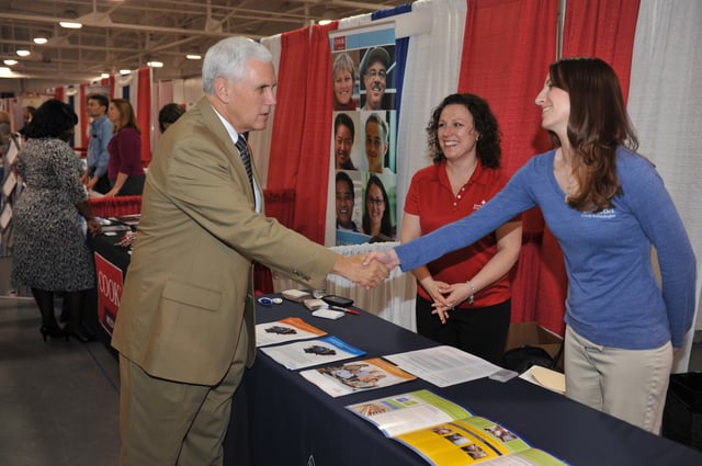 Mike Pence shakes hands at the Indiana State Fair in Indianapolis in 2014