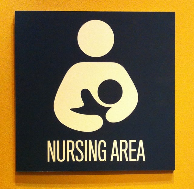 Sign for a private nursing area at a museum using the international breastfeeding symbol