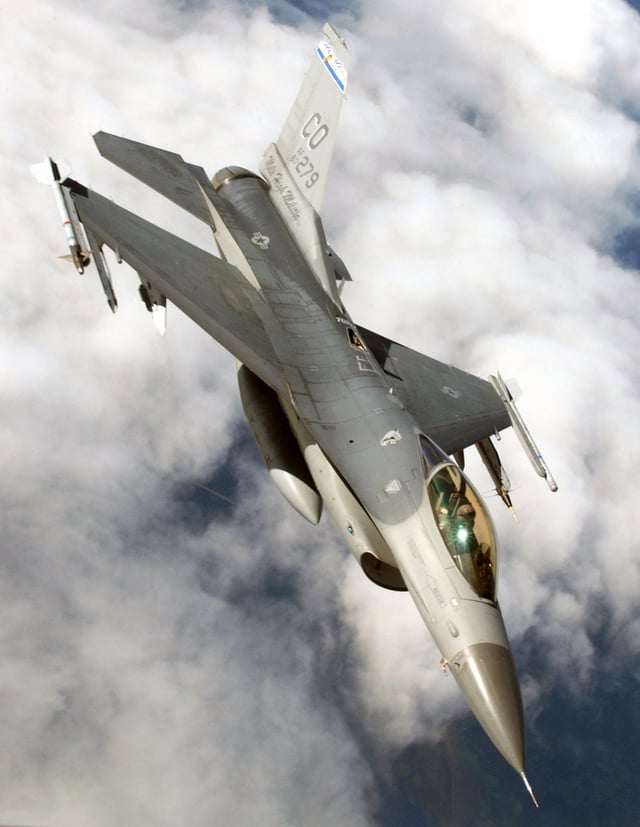 An F-16C of the Colorado Air National Guard with AIM-9 Sidewinder missiles, an Air Combat Maneuvering Instrumentation pod, and a centerline fuel tank (300 gal capacity).