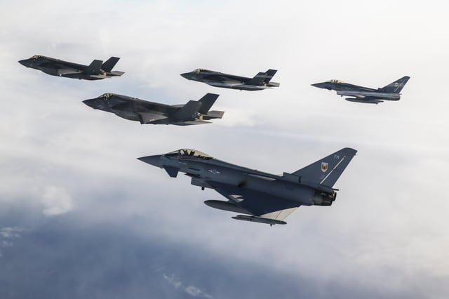 The first RAF F-35 to arrive in the United Kingdom escorted by two USMC F-35Bs and a pair of RAF Typhoon FGR4s en route to the 2016 Royal International Air Tattoo.