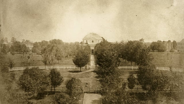 View of the Quad in 1859. The Rotunda can be seen at center, with the halls visible in the background. All buildings depicted were destroyed on April 4, 1865.