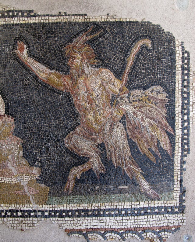 Ancient Roman mosaic showing a horned, goat-legged Pan holding a shepherd's crook. Much of Satan's traditional iconography is apparently derived from Pan.