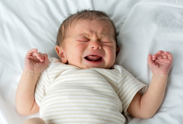 A crying newborn, a few days after birth