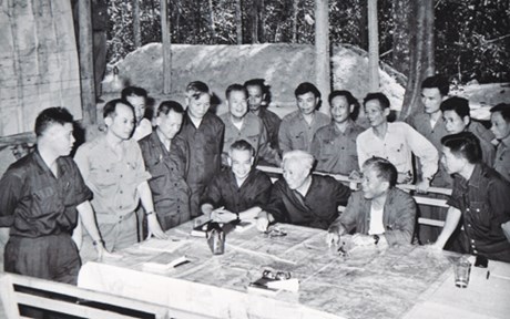 Le Duc Tho representing North Vietnam, alongside Văn Tiến Dũng representing the People's Army of Vietnamand Phạm Hùng representing the Provisional Revolutionary Government of the Republic of South Vietnam discuss war plans for the Ho Chi Minh campaign.