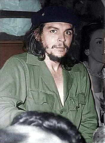 Guevara in his trademark olive-green military fatigues and beret
