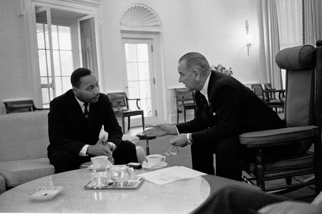 Lyndon B. Johnson, 36th President of the United States (1963–1969), meeting with Martin Luther King Jr. at the Oval Office in 1963.
