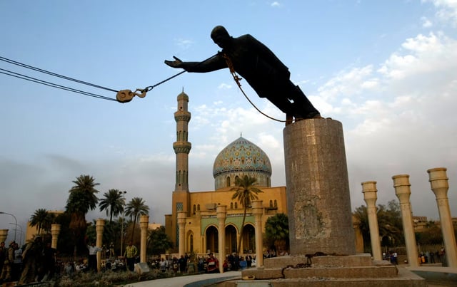 The April 2003 toppling of Saddam Hussein's statue by US Army troops in Firdos Square in Baghdad shortly after the Iraq War invasion.