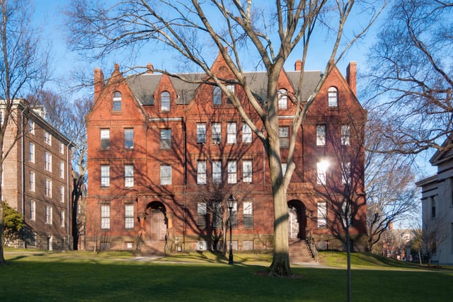 Slater Hall, built 1879, designed by Stone and Carpenter in Ruskinian Gothic style. When its foundation was dug at the south end of the College Green, neighbors objected that the Green "upon which so many are accustomed to gaze while taking daily walks" would be blocked from view, and Slater Hall was re-sited facing the Front Green