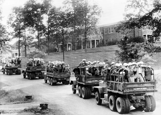 U.S. Army trucks loaded with U.S. Marshals on the University of Mississippi campus