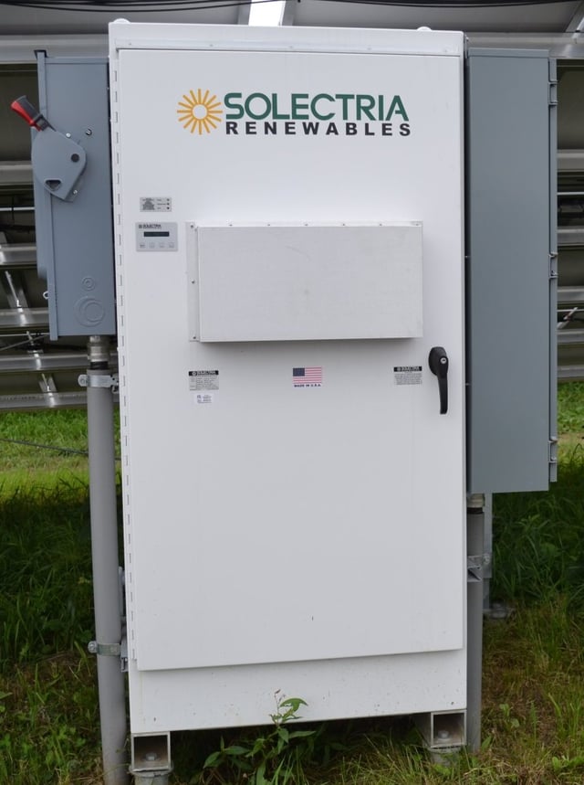 Central inverter with AC and DC disconnects (on the side), monitoring gateway, transformer isolation and interactive LCD.